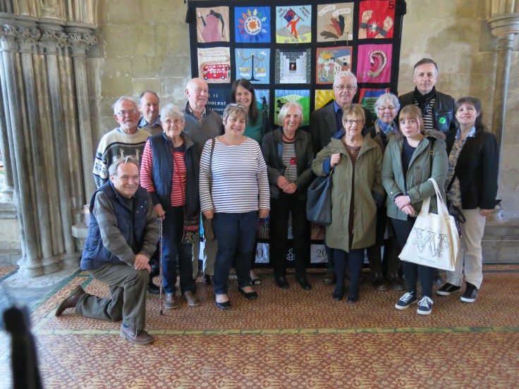 In front of the tapestry